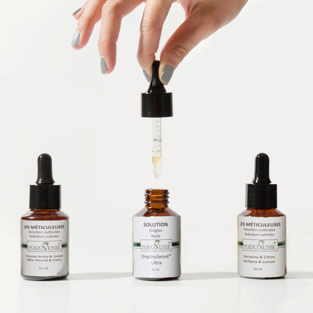 Three small jars of Podosense's nail care oil products.