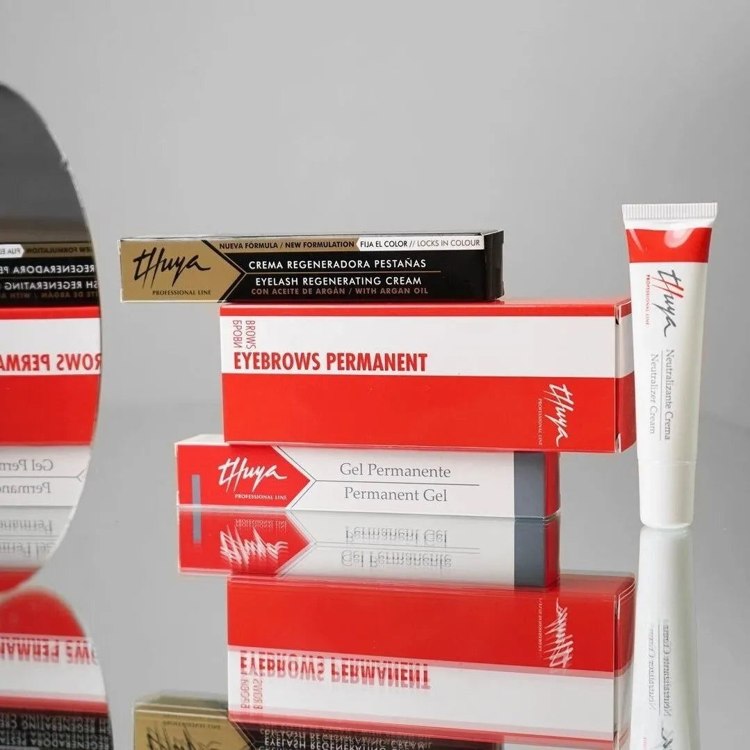 Boxes from Thuya beauty for eyebrow care are stacked on top of one another.