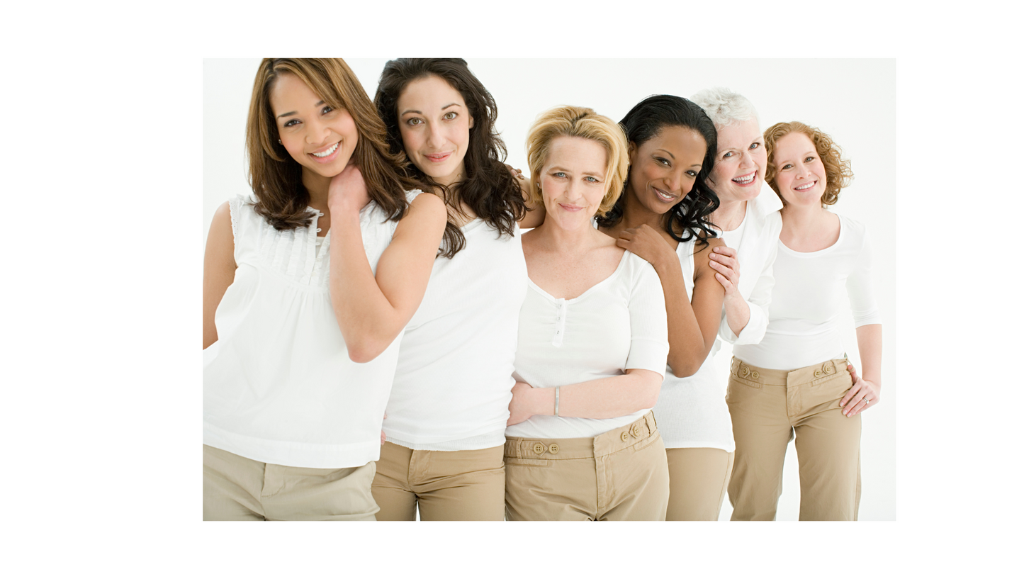 A group of uniquely beautiful women grouped together, smiling.