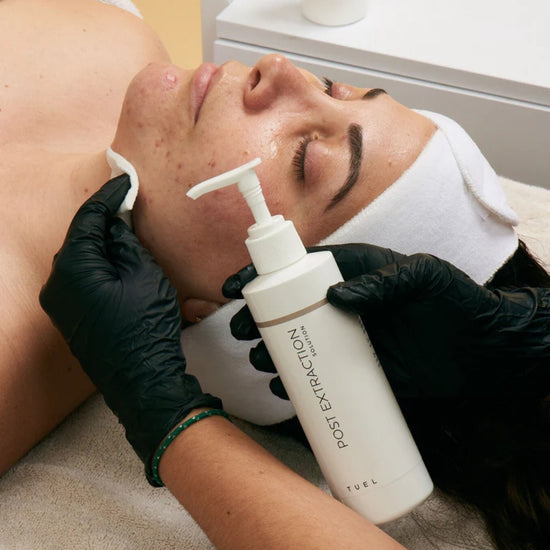 A women receives a Tuel Skincare treatment from her esthetician.