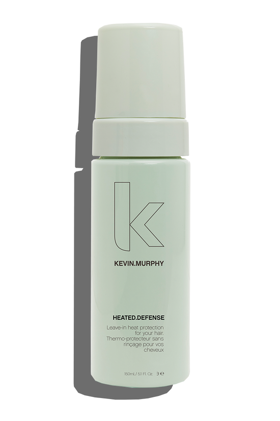 Kevin Murphy - heated defense 150ml  hair against daily life’s biggest aggressor, heat damage. HEATED.DEFENSE is a weightless and invisible leave-in treatment foam to protect your hair against damage associated with heated and mechanical tools. Providing heat protection up to 232˚C / 450˚F, this leave-in foam distributes easily and disappears in all hair types, providing a weightless protective shield.